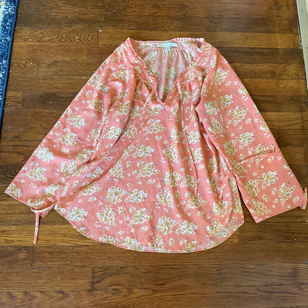 Peach colored blouse with floral print